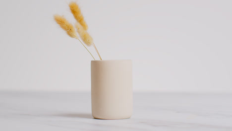 Still-Life-Of-Dried-Grasses-In-Ceramic-Vase-As-Part-Of-Relaxing-Spa-Day-Decor-With-Copy-Space-On-Right-Side-Of-Frame